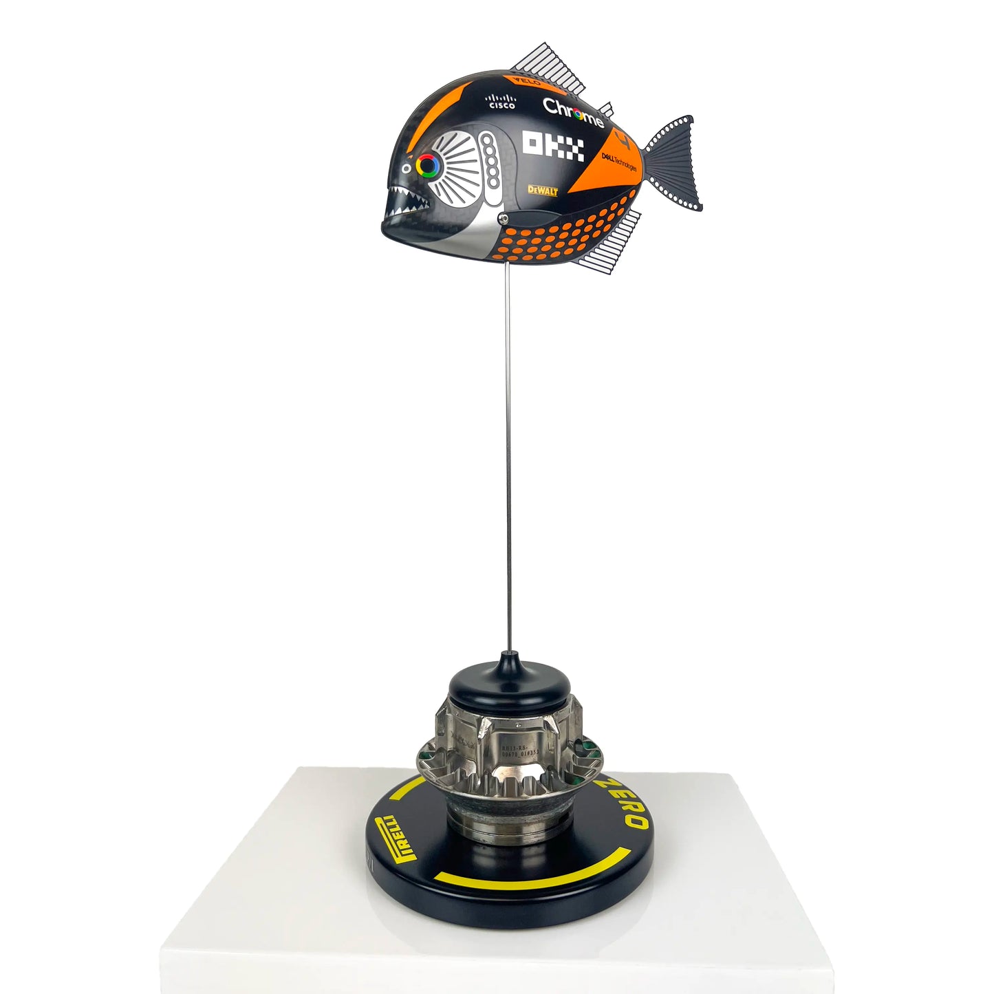 Carbon Fibre Piranha Fish with 2024 McLaren F1 Livery on yellow Pirelli base with F1 wheel nut