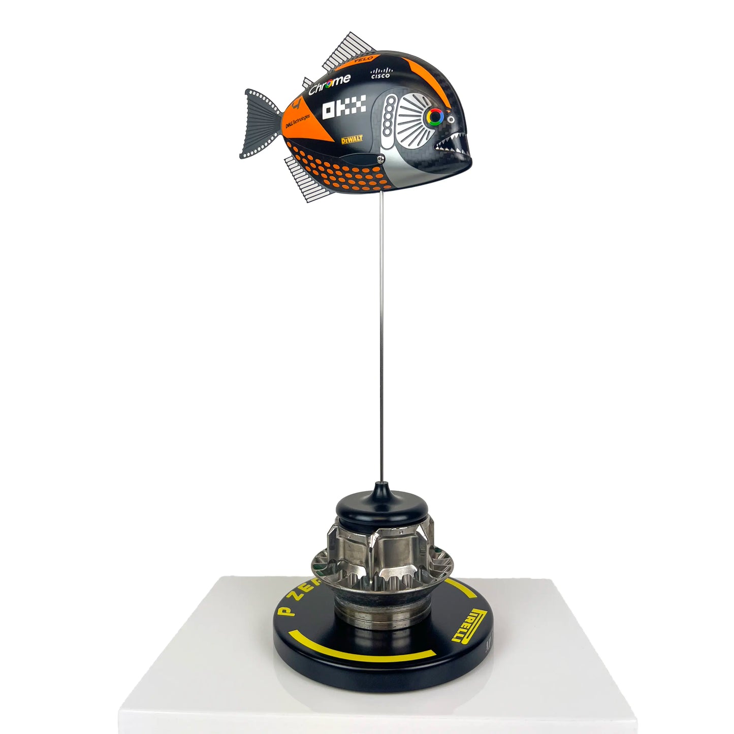 Carbon Fibre Piranha Fish with 2024 McLaren F1 Livery on yellow Pirelli base with F1 wheel nut