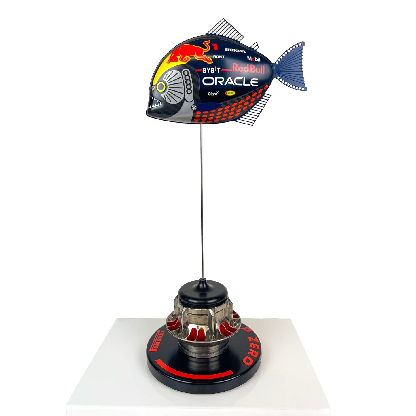 Carbon Fibre Piranha Fish with 2024 RedBull Inspired F1 Livery on red Pirelli base with F1 wheel nut