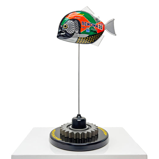 Carbon fibre Piranha sculpture with Mazda 787B livery on a black base with F1 gear