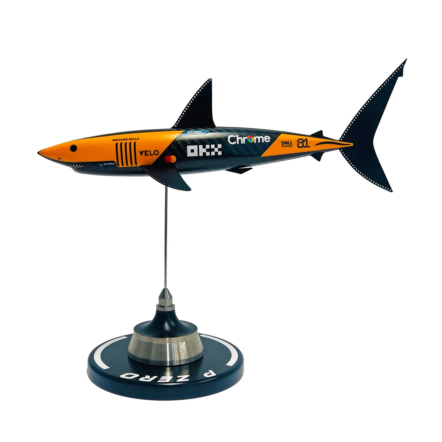 Carbon fibre sculpture of a shark with McLaren F1 branding on a white background