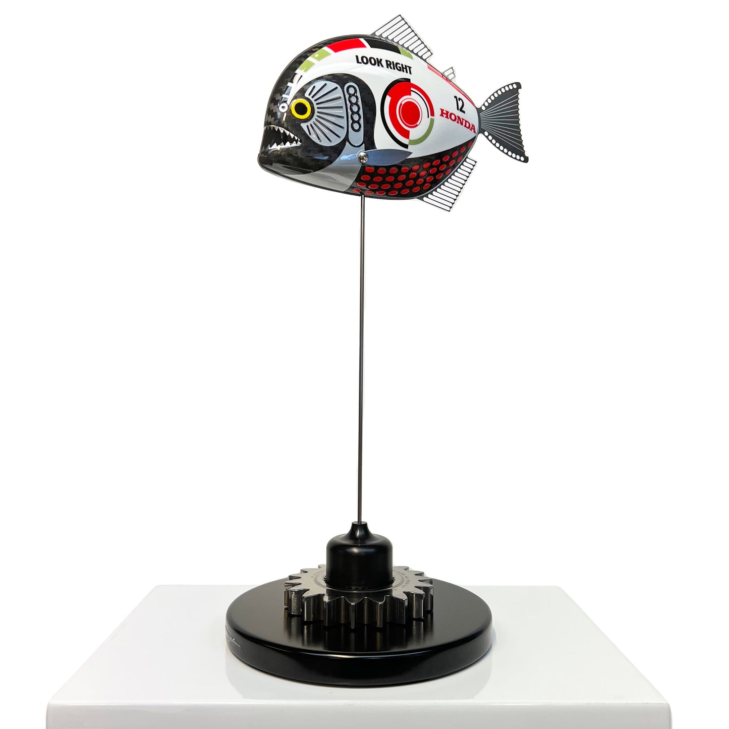 Carbon fibre baby piranha sculpture with BAR Honda F1 livery on a black base with F1 gear