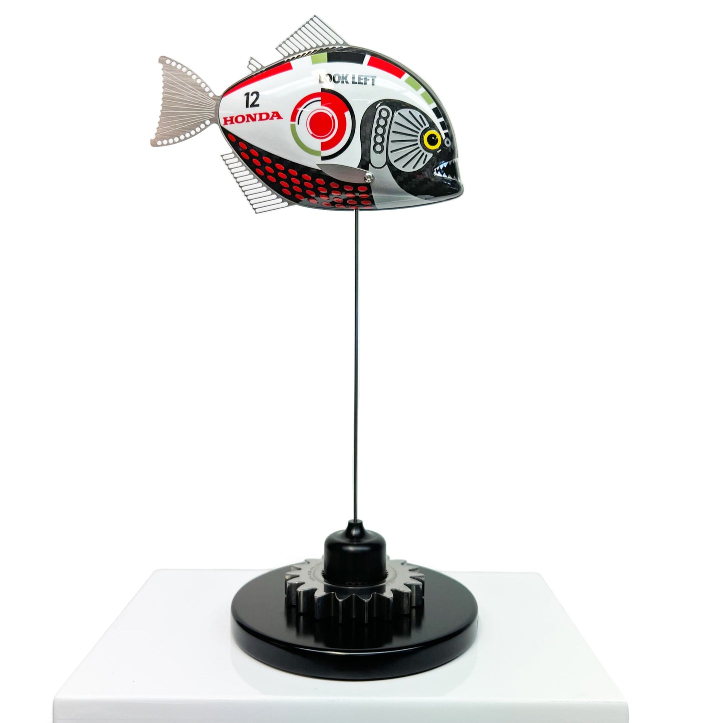 Carbon fibre baby piranha sculpture with BAR Honda F1 livery on a black base with F1 gear