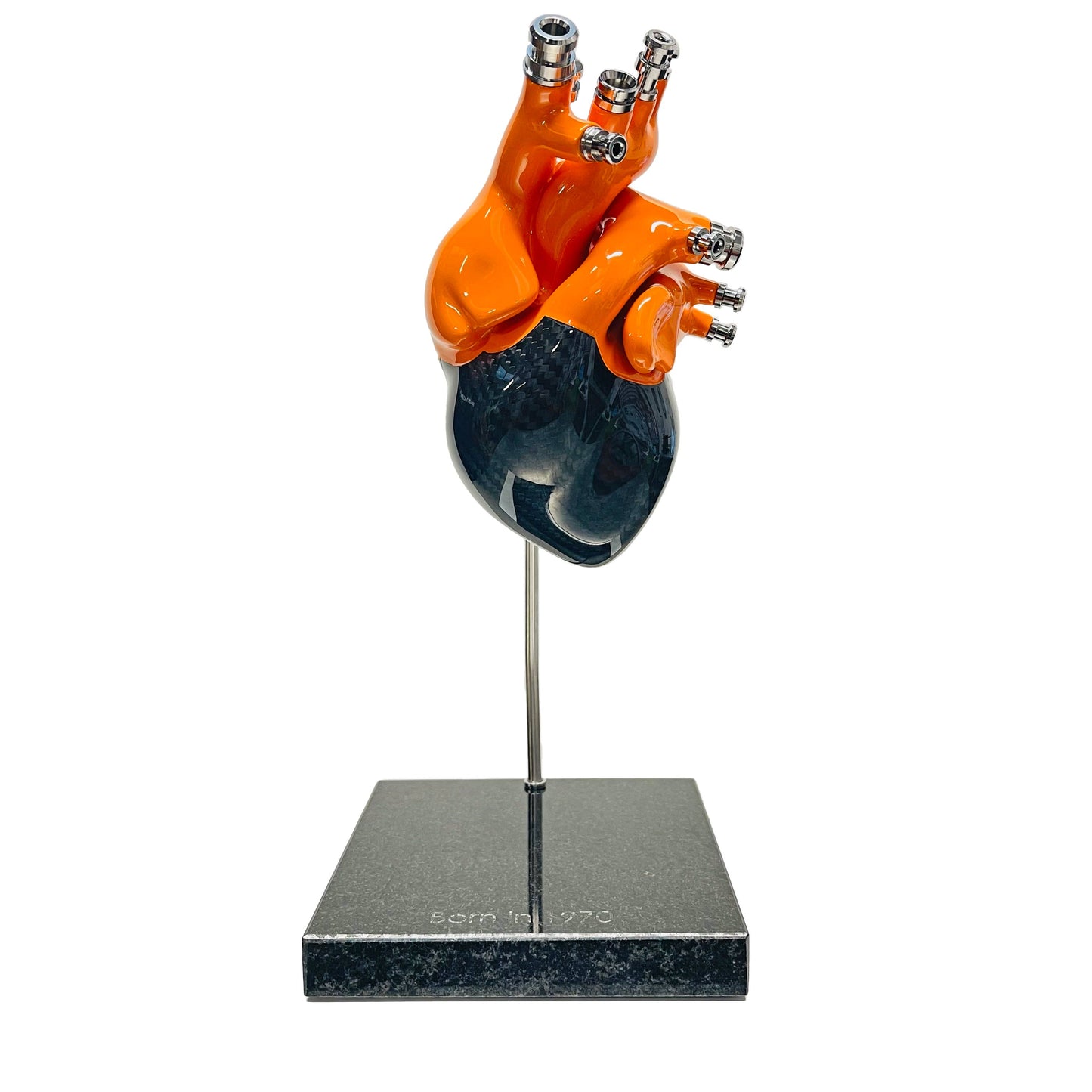 Carbon fibre Human Heart with Orange painted detail on a granite base