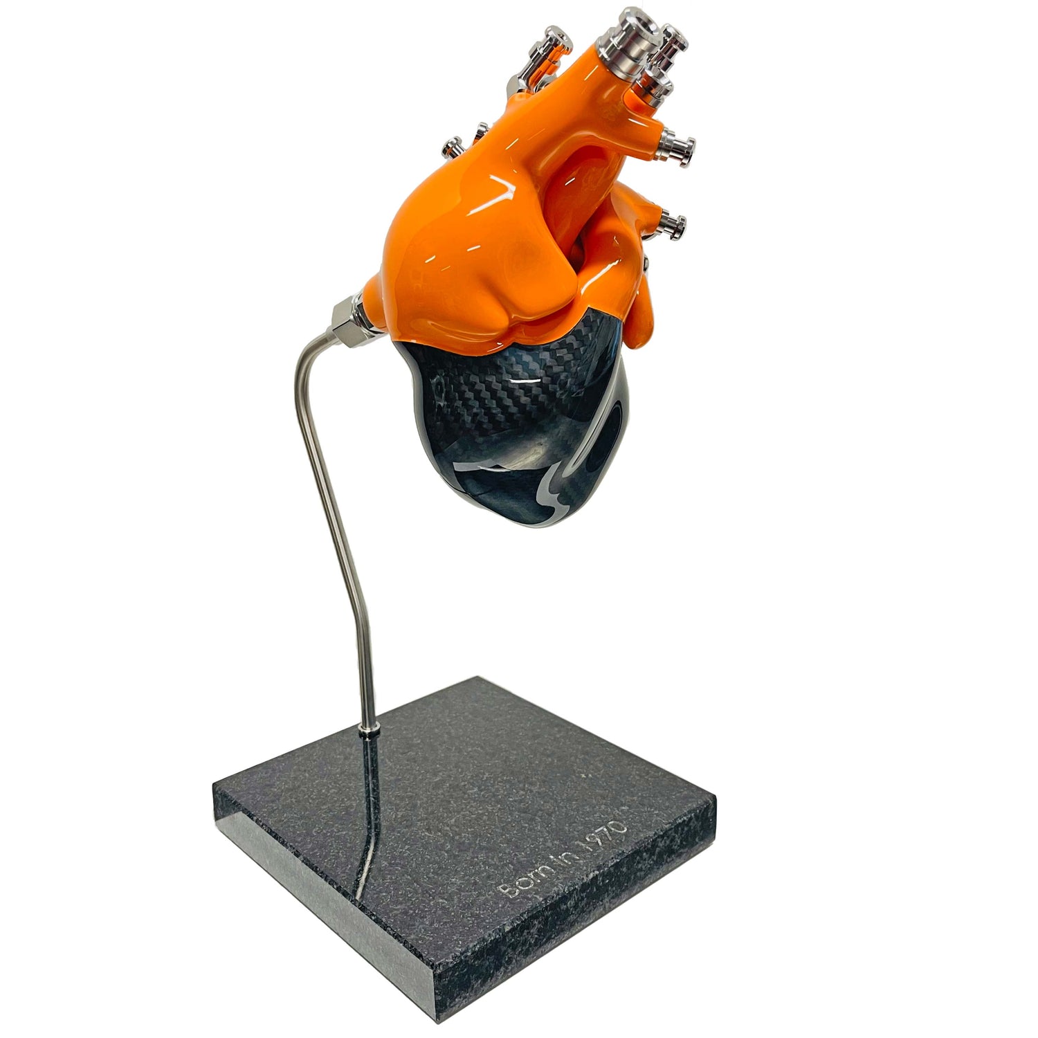 Carbon fibre Human Heart with Orange painted detail on a granite base