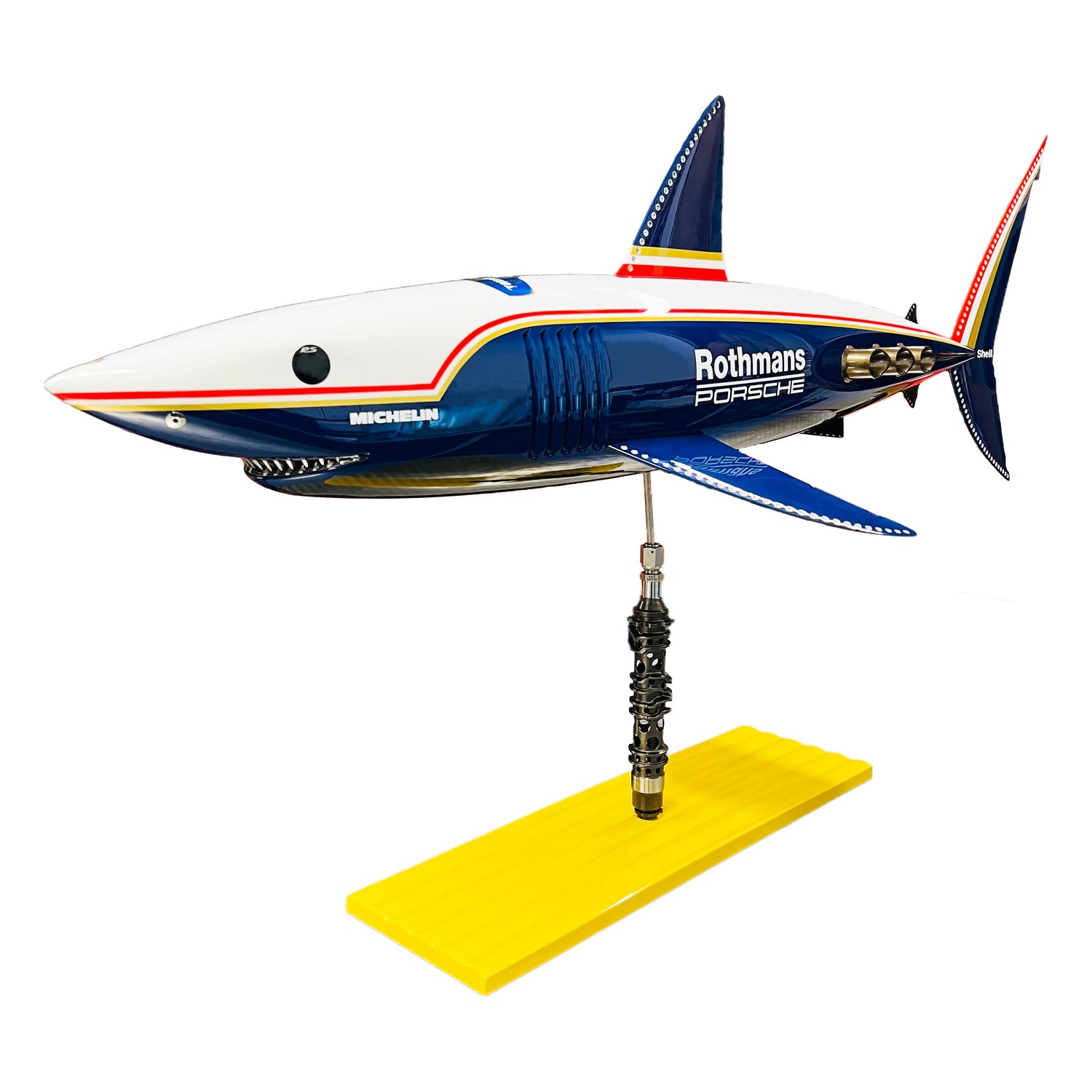 Carbon fibre shark with Rothmans livery on a sandy base with F1 part