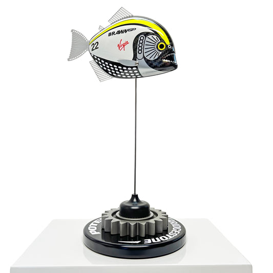 Carbon fibre piranha sculpture with Brawn GP livery on a black base with F1 gear