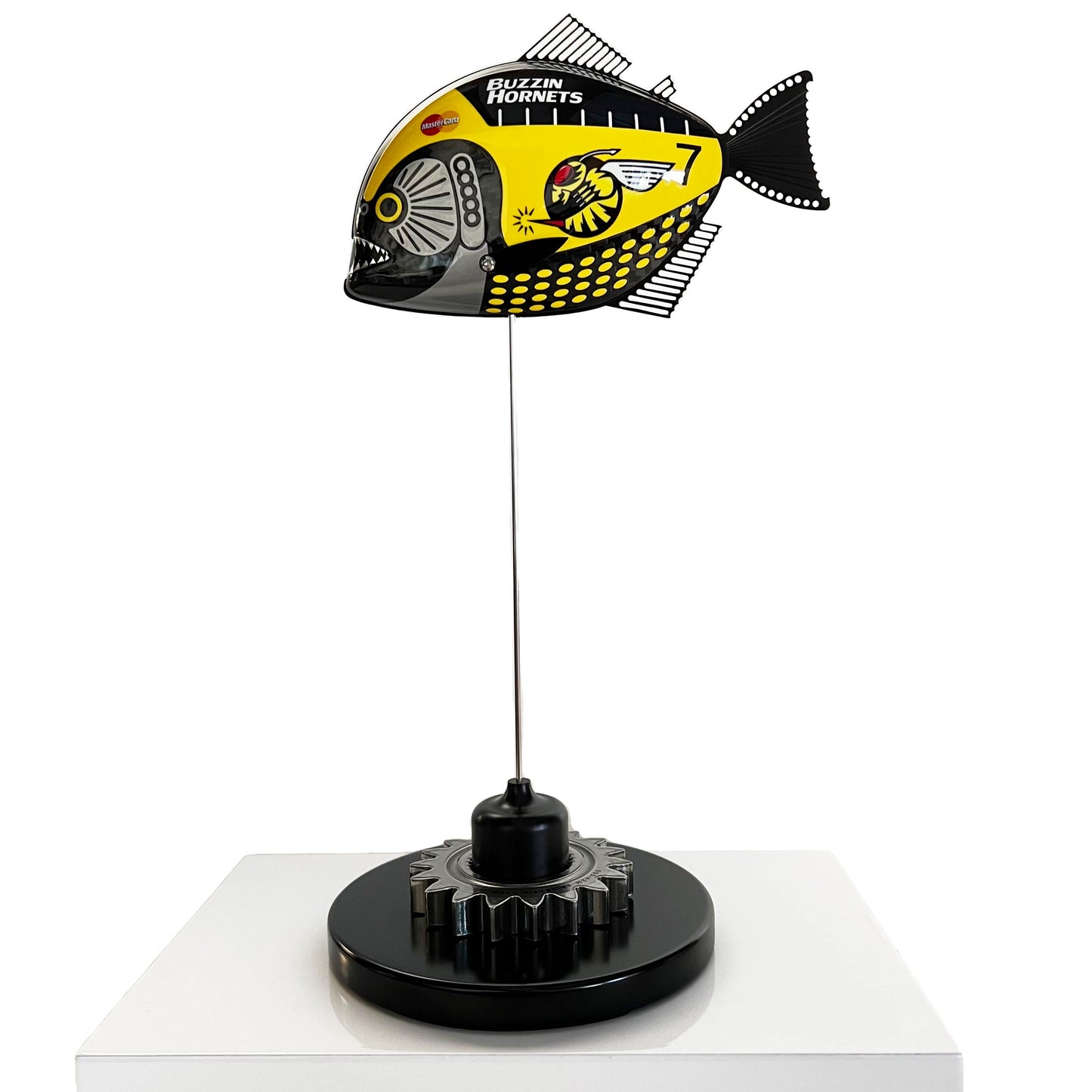 Carbon fibre piranha sculpture with Jordan "Buzzin Hornets" livery on a black base with F1 gear
