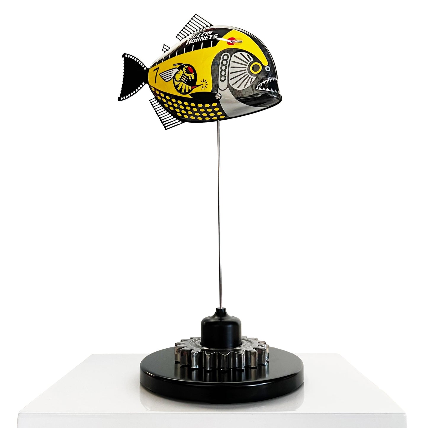Carbon fibre piranha sculpture with Jordan "Buzzin Hornets" livery on a black base with F1 gear