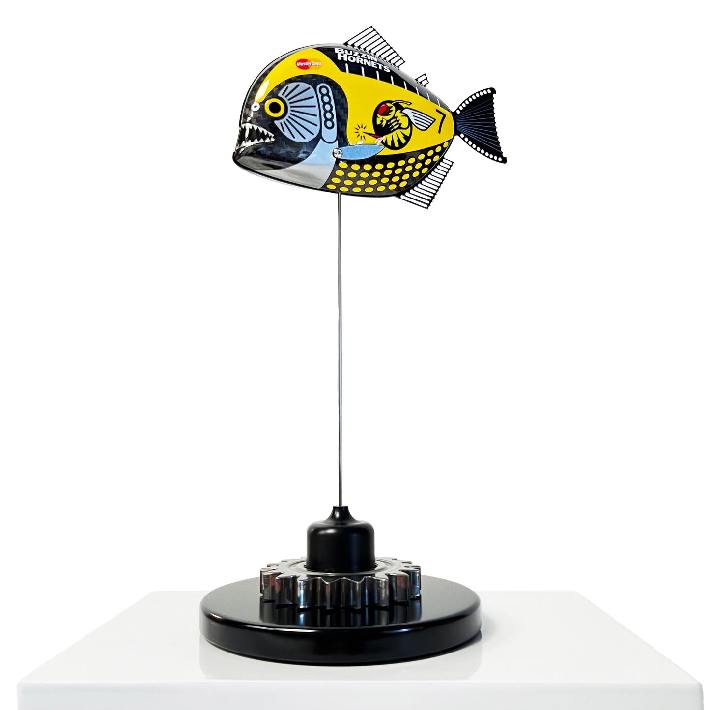 Carbon fibre piranha sculpture with Jordan "Buzzin Hornets" livery on a black base with F1 gear