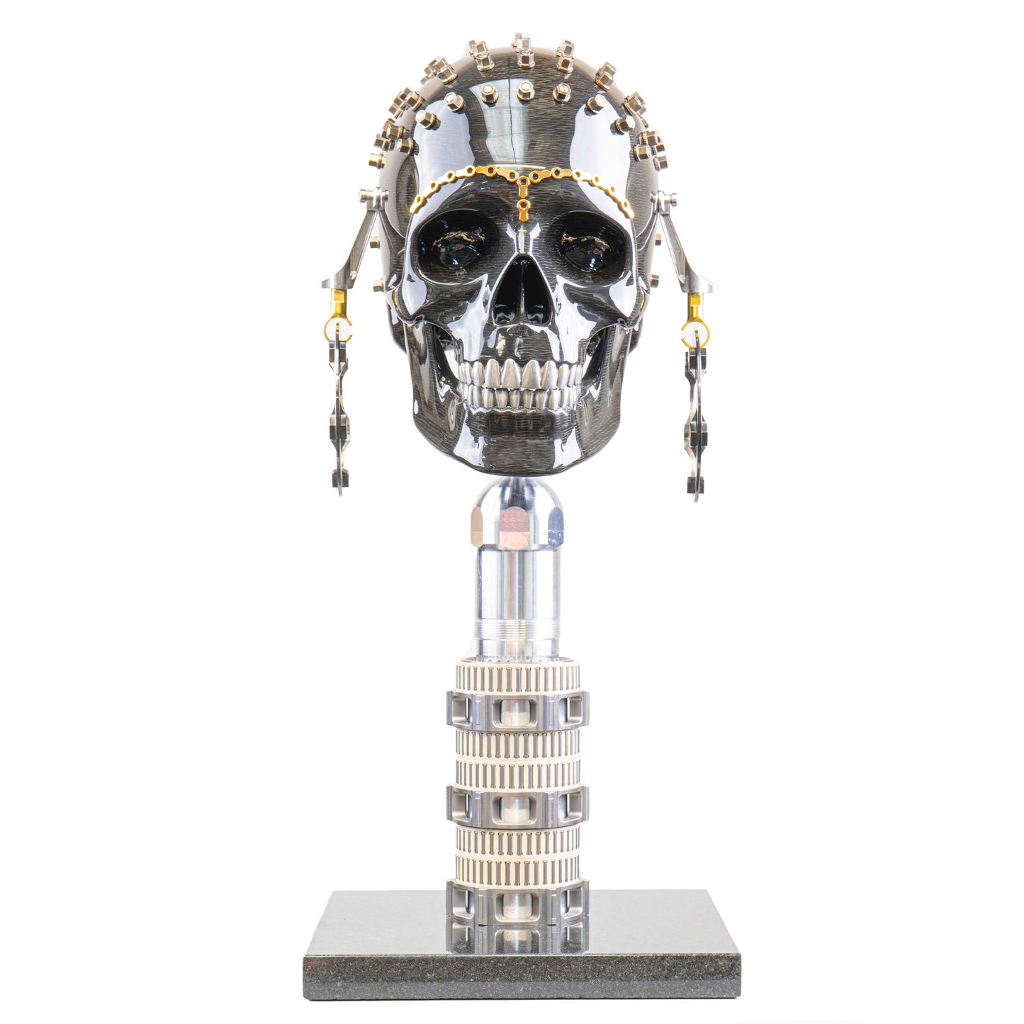Carbon fibre human skull with F1 parts on a granite base