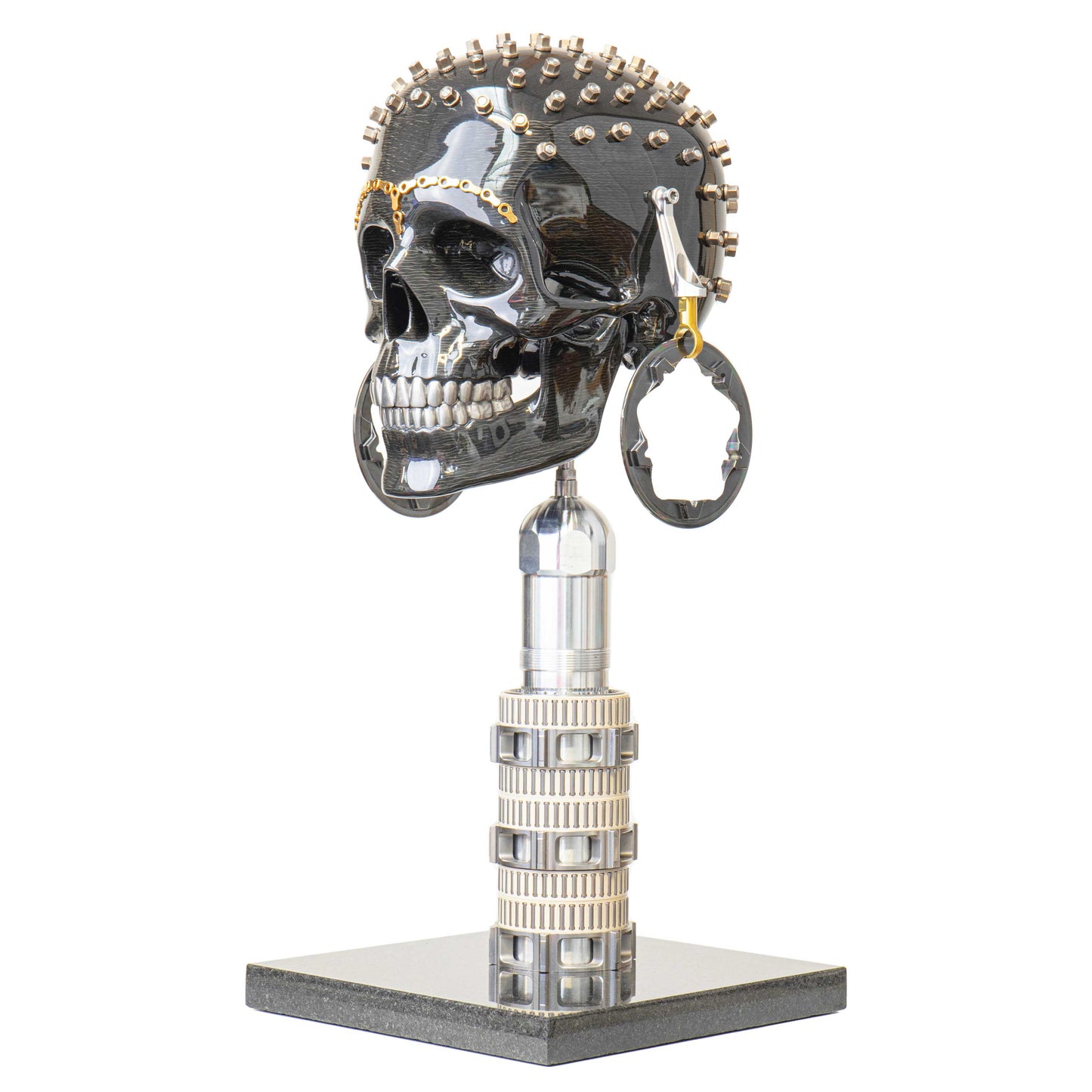 Carbon fibre human skull with F1 parts on a granite base