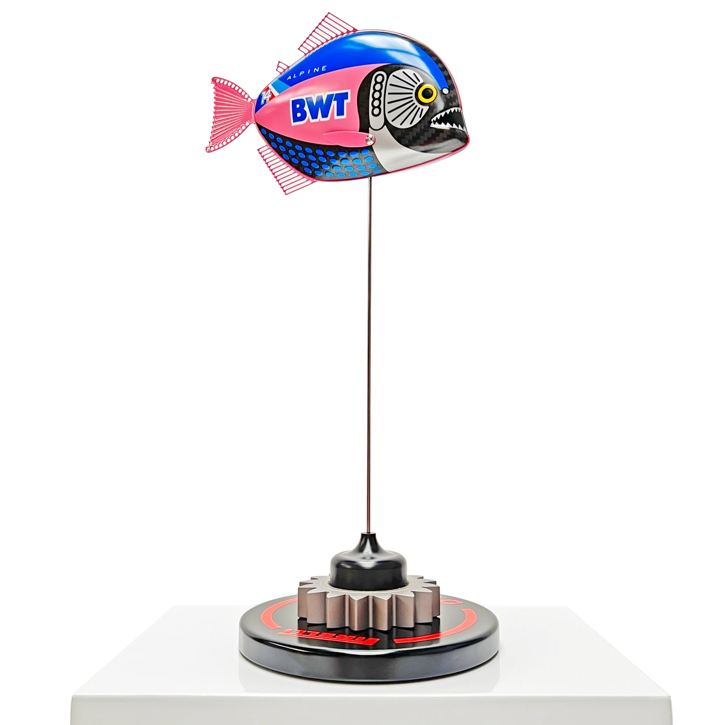 Carbon fibre baby piranha sculpture with Alpine F1 livery on a black base with F1 gear