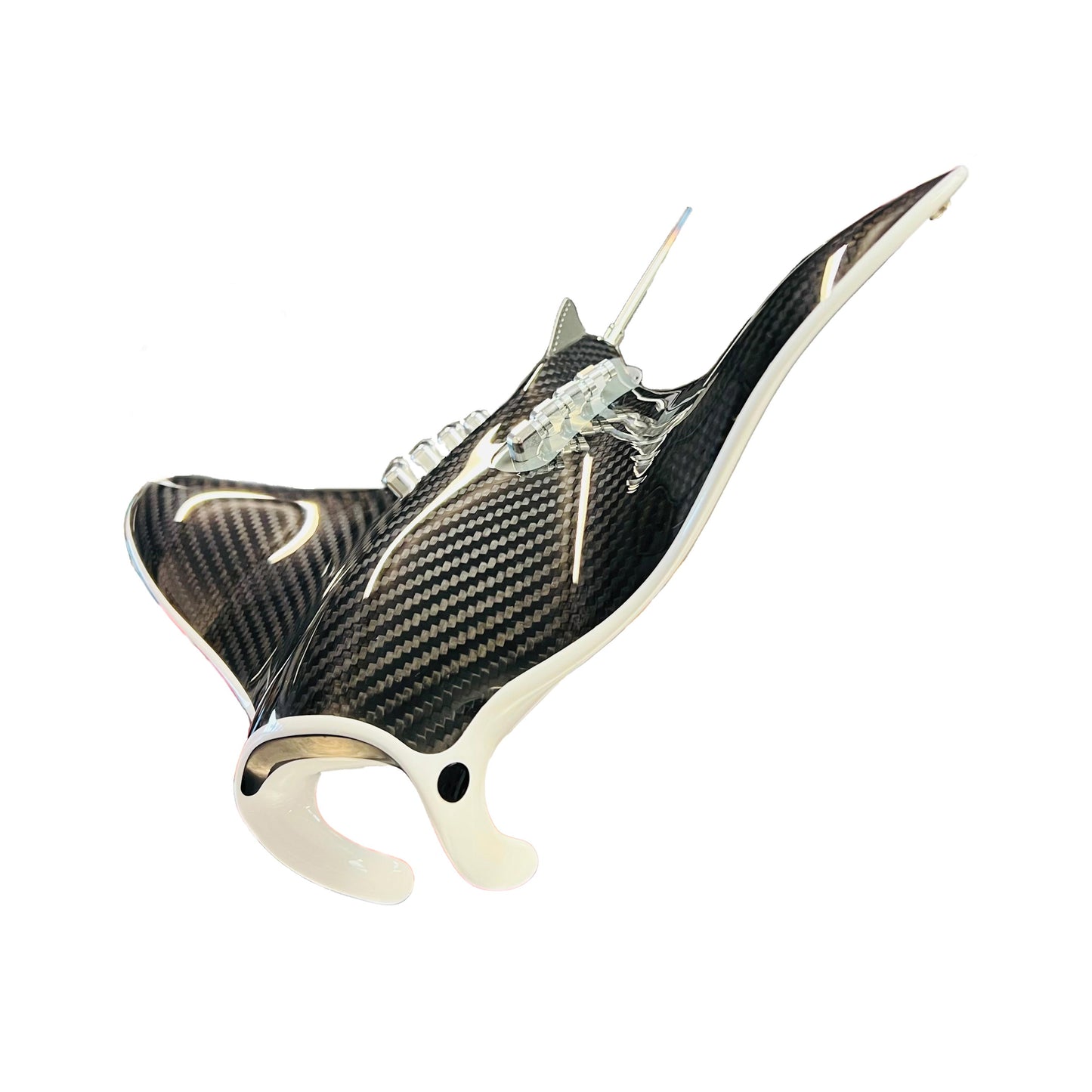 Carbon fibre Manta Ray sculpture on a black base with F1 gear