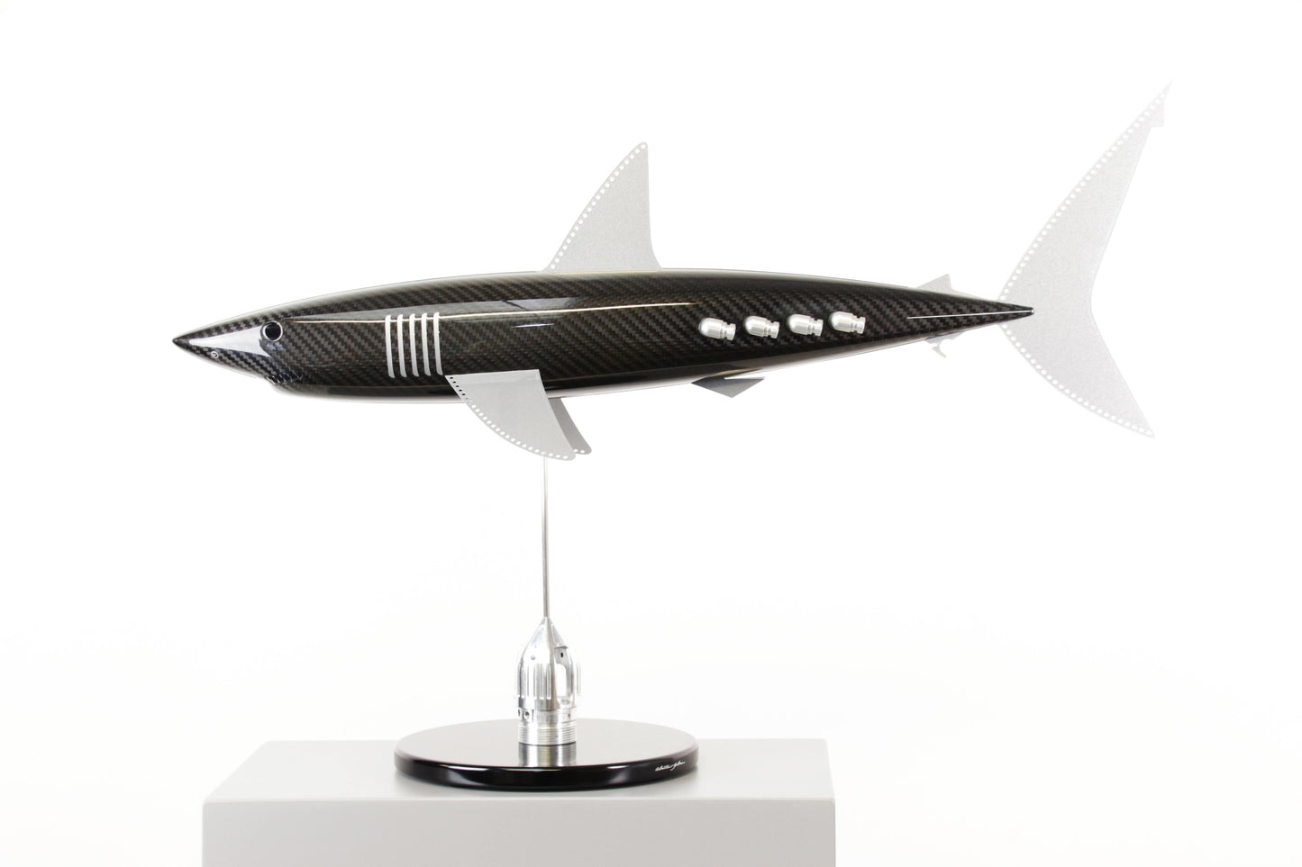 Carbon fibre Mako Shark sculpture on a black base with F1 parts