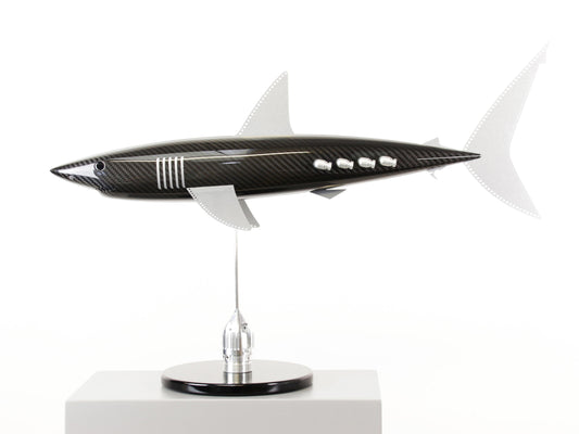 Carbon fibre Mako Shark sculpture on a black base with F1 parts