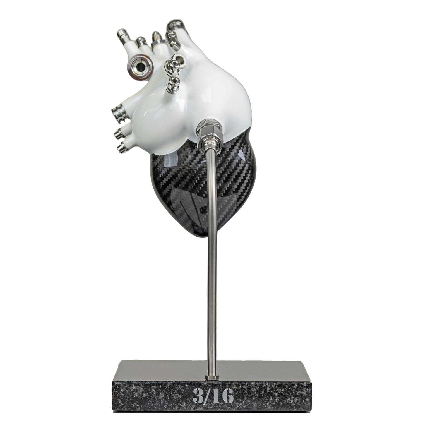 Carbon fibre human heart with white painted detail on a granite base