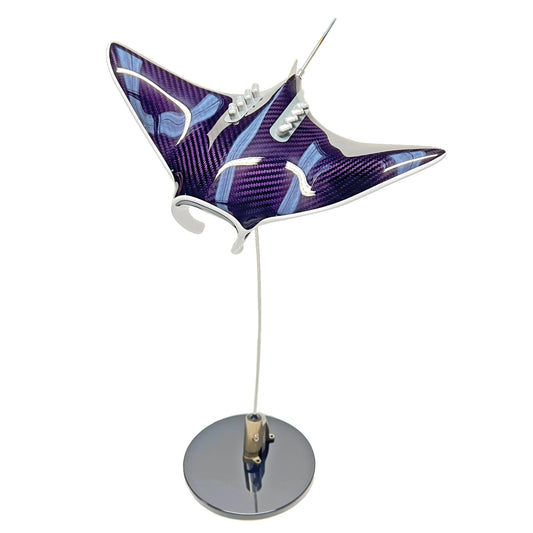 Carbon fibre purple tinted Manta ray on a black base with F1 part