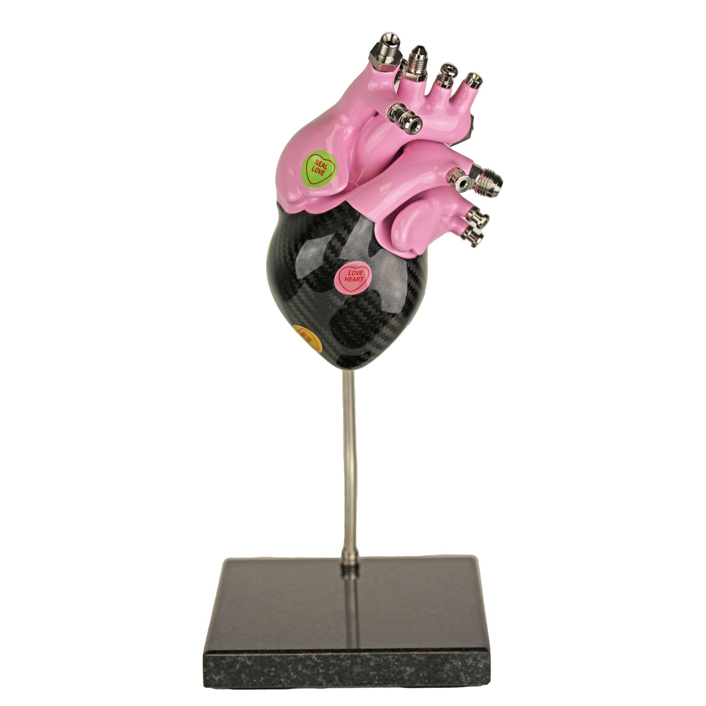 Carbon fibre human heart with Pink painted detail on a granite base