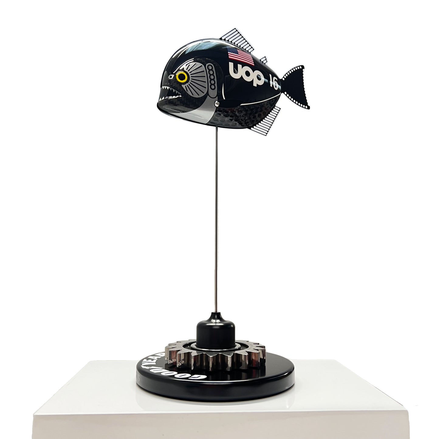 Carbon fibre Piranha fish with UOP livery on a black base with F1 gear