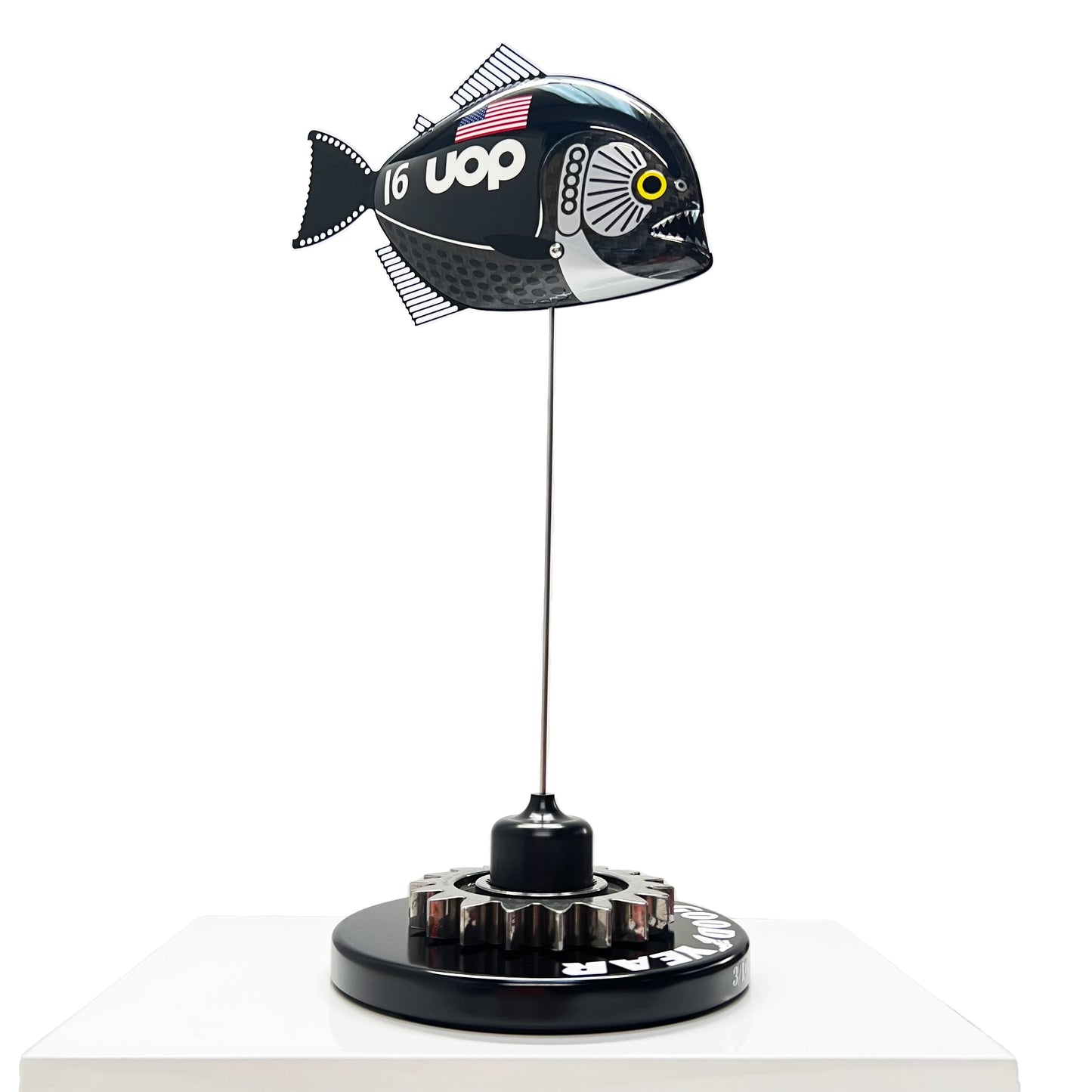 Carbon fibre Piranha fish with UOP livery on a black base with F1 gear
