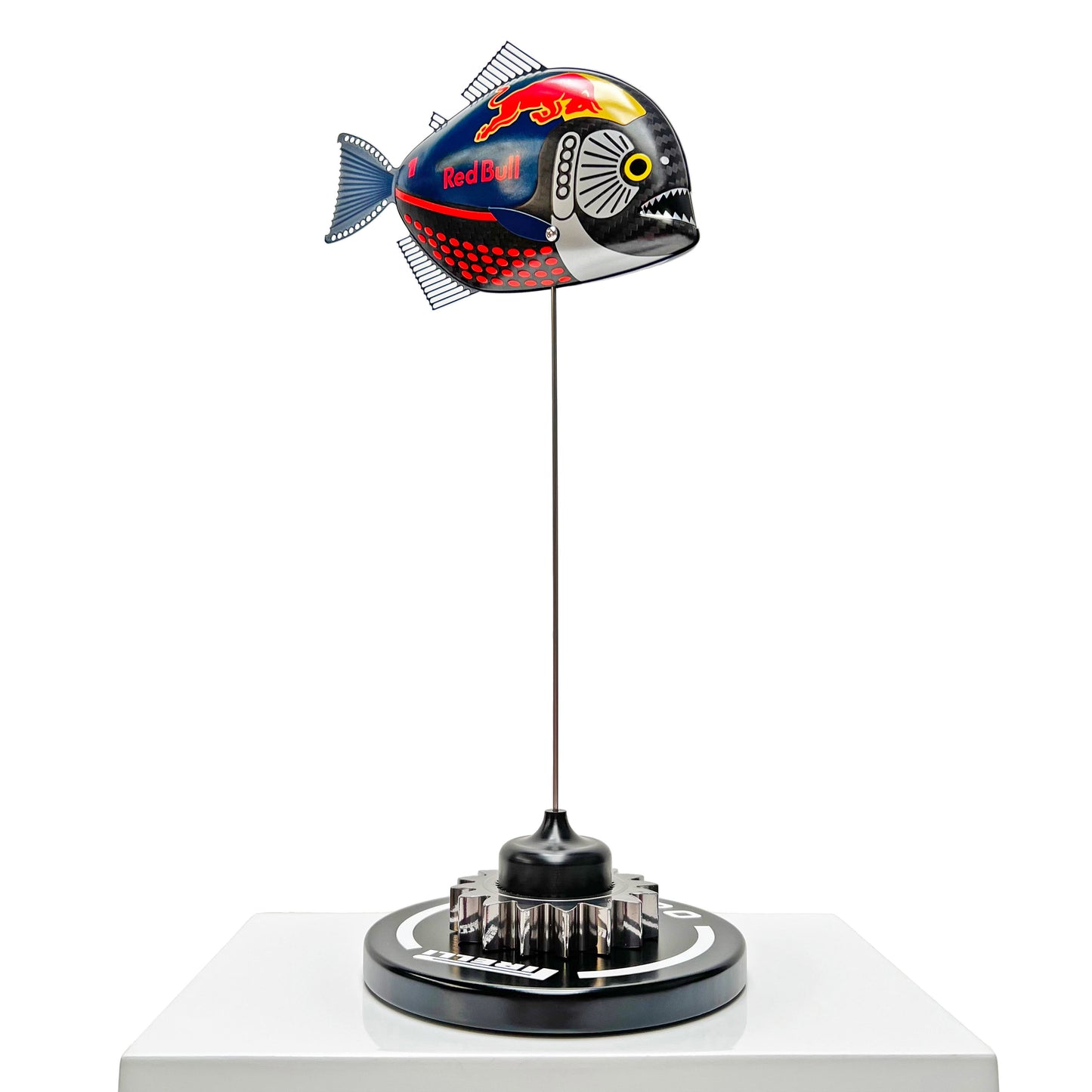Carbon fibre Piranha fish with RedBull F1 livery on a black base with F1 gear