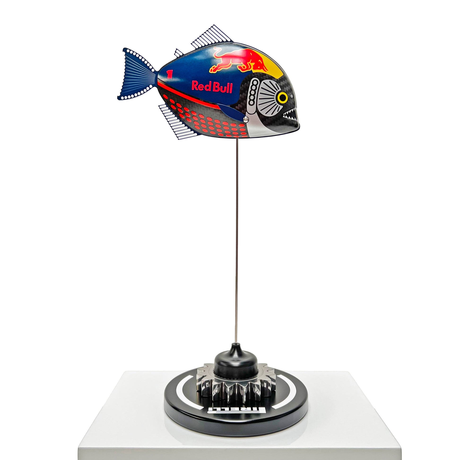 Carbon fibre Piranha fish with RedBull F1 livery on a black base with F1 gear