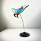 Gulf Ford inspired carbon fibre manta ray sculpture on a stand with white background