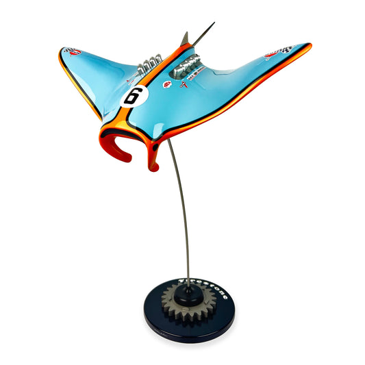 Gulf Ford inspired carbon fibre manta ray sculpture on a stand with white background