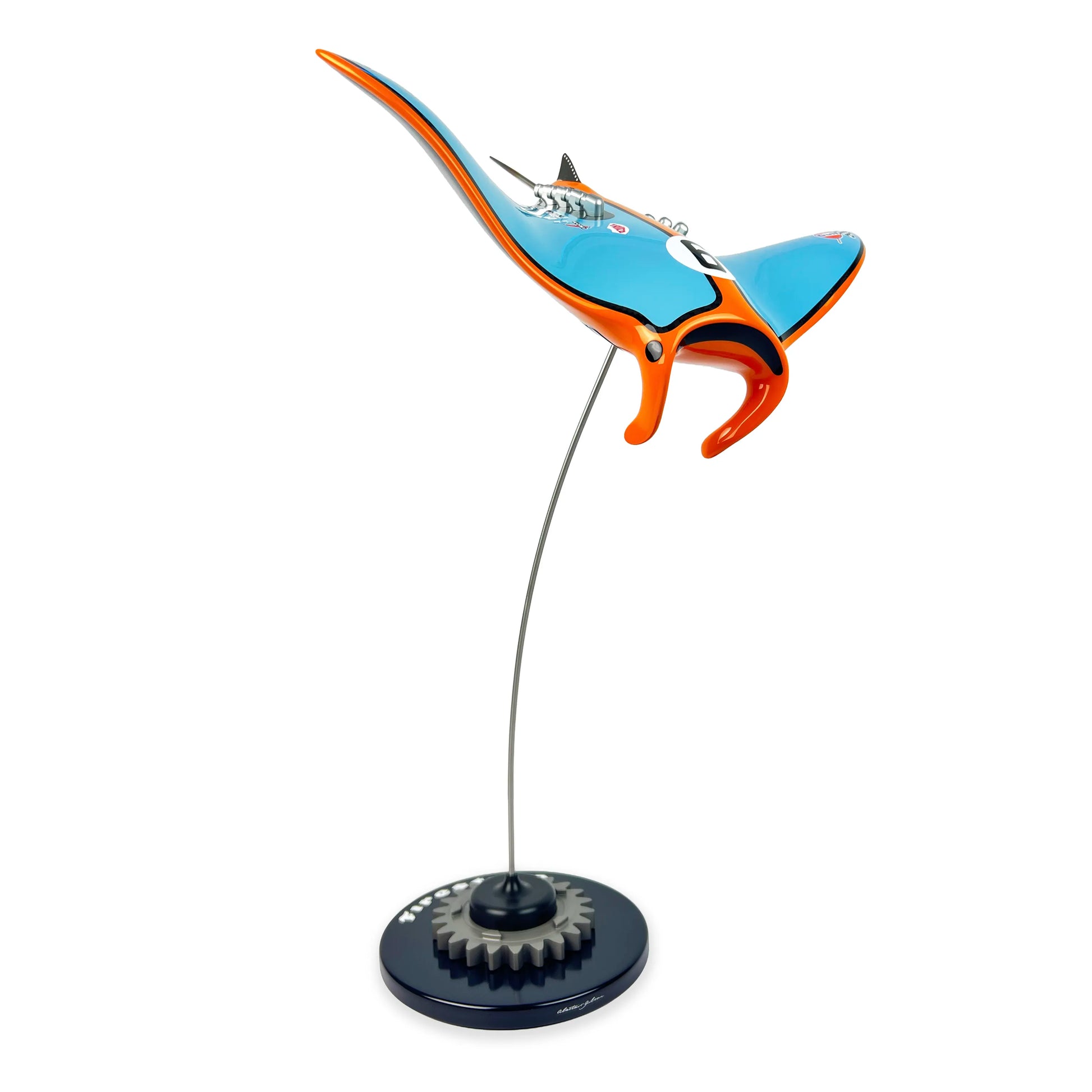 Gulf Ford inspired carbon fibre manta ray sculpture on a stand with white background