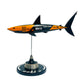 Carbon fibre sculpture of a shark with McLaren F1 branding on a white background