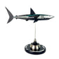 Carbon Fibre Sculpture of a shark with Mercedes racing livery on a stand against a white background