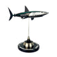 Carbon Fibre Sculpture of a shark with Mercedes racing livery on a stand against a white background