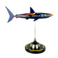 Carbon Fibre Sculpture of a shark with RedBull racing livery on a stand against a white background