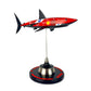 Carbon Fibre Sculpture of a shark with Ferrari Inspired racing livery on a stand against a white background