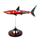 Carbon Fibre Sculpture of a shark with Ferrari Inspired racing livery on a stand against a white background