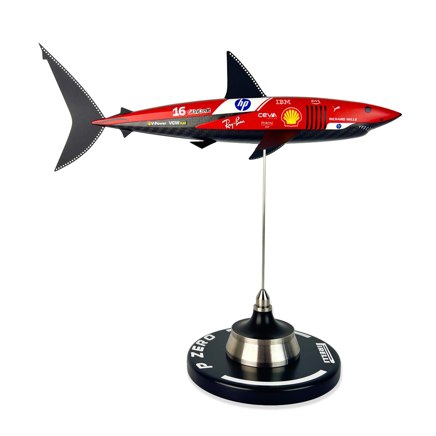 Carbon Fibre Sculpture of a shark with Ferrari Inspired racing livery on a stand against a white background