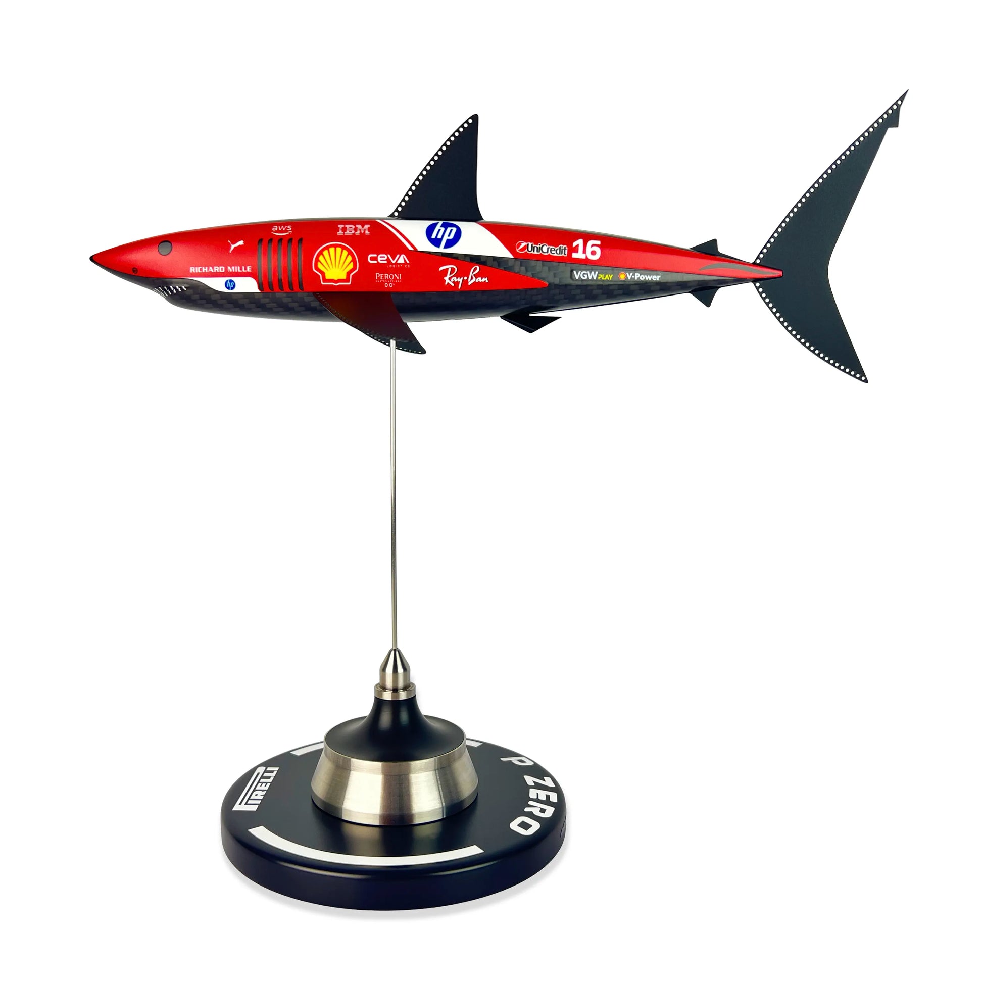 Carbon Fibre Sculpture of a shark with Ferrari Inspired racing livery on a stand against a white background