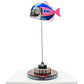 Carbon fibre baby piranha sculpture with Alpine F1 livery on a black base with F1 gear
