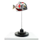 Carbon fibre baby piranha sculpture with BAR Honda F1 livery on a black base with F1 gear