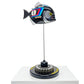 Carbon fibre baby piranha sculpture with BMW livery on a black base with F1 gear