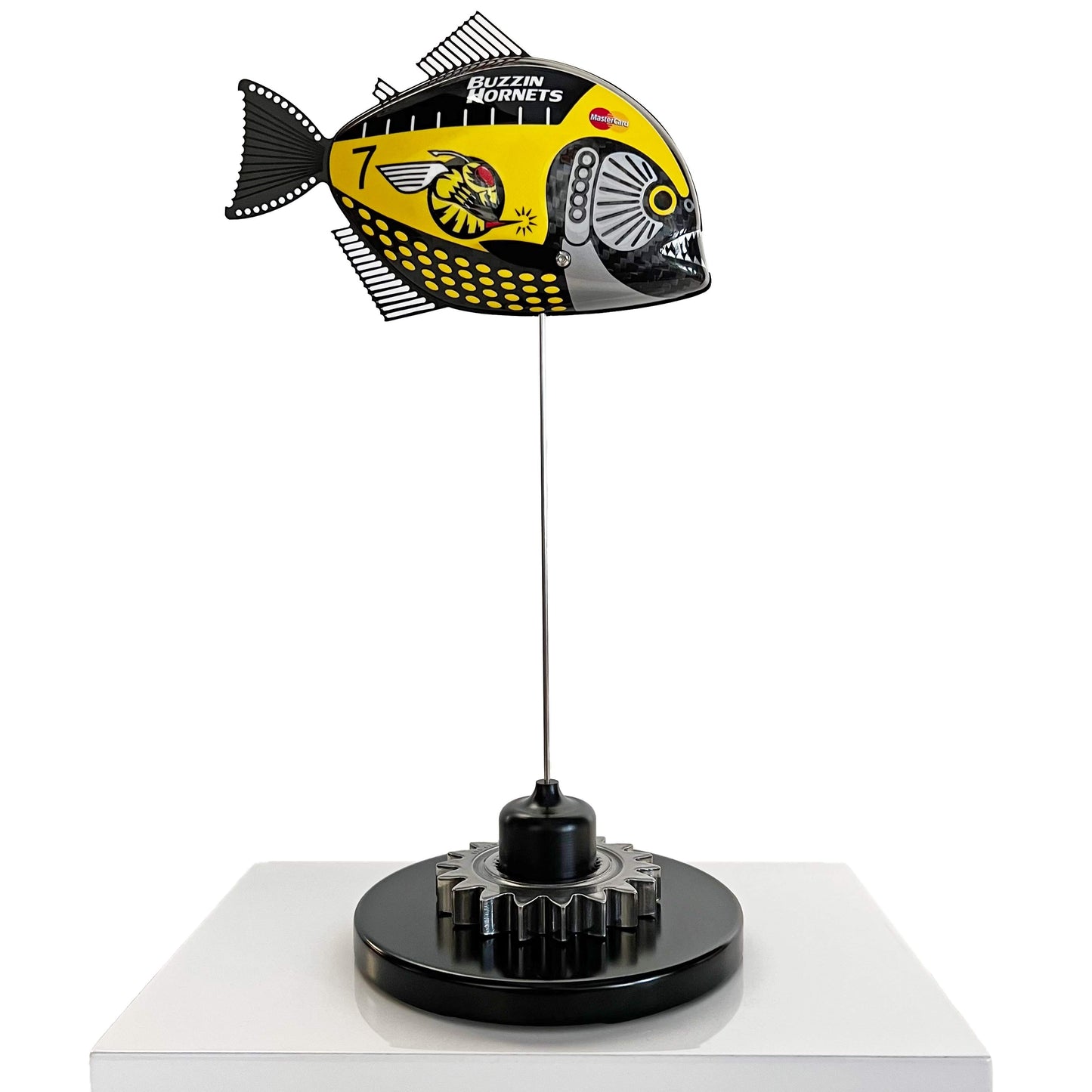 Carbon fibre piranha sculpture with Jordan "Buzzin Hornets" livery on a black base with F1 gear