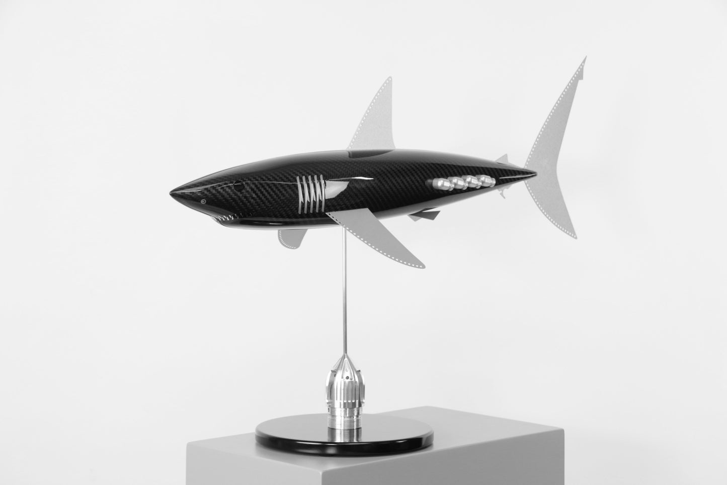 Carbon fibre Mako Shark sculpture on a black base with F1 parts