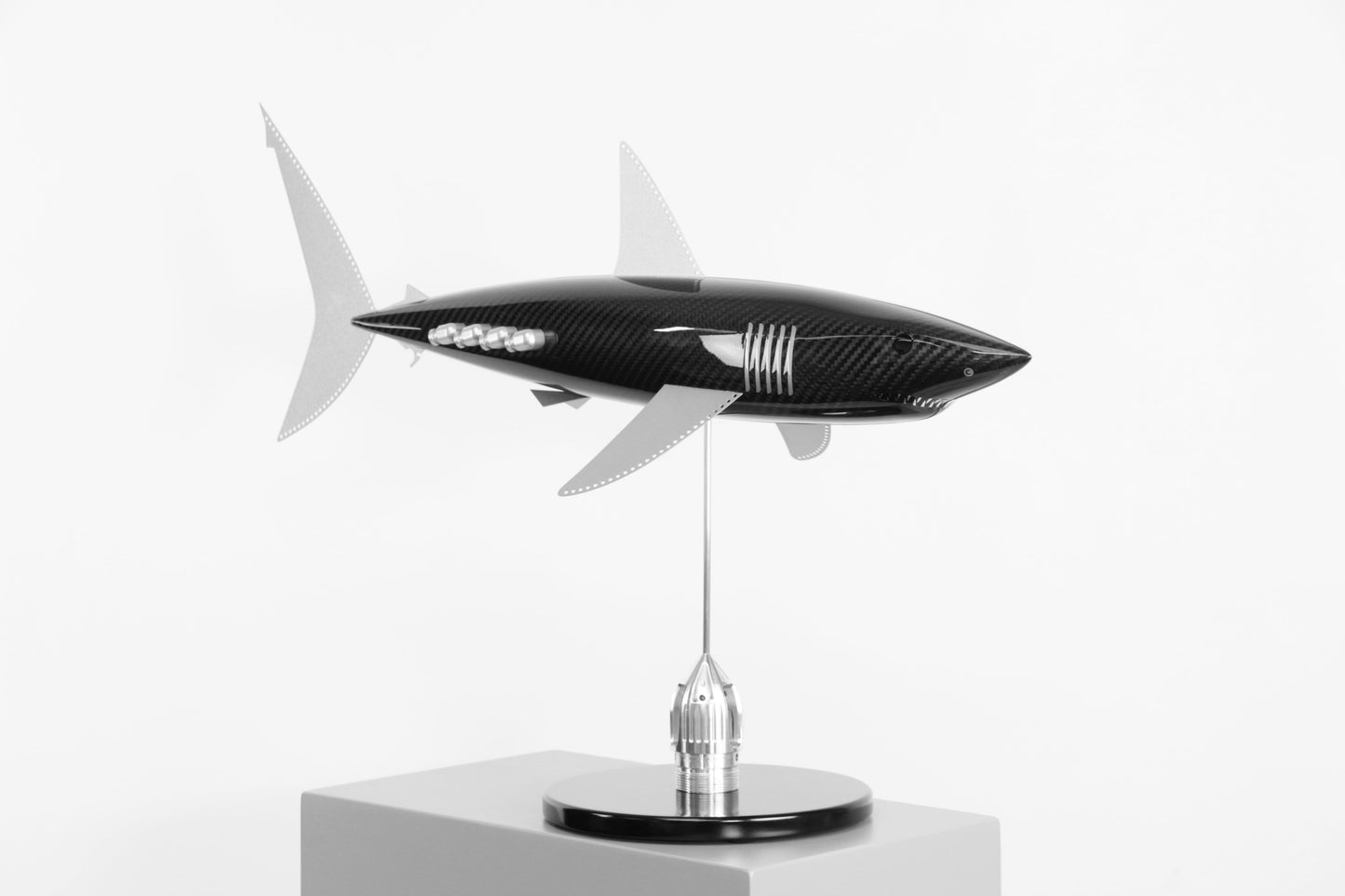 Carbon fibre Mako Shark sculpture on a black base with F1 parts