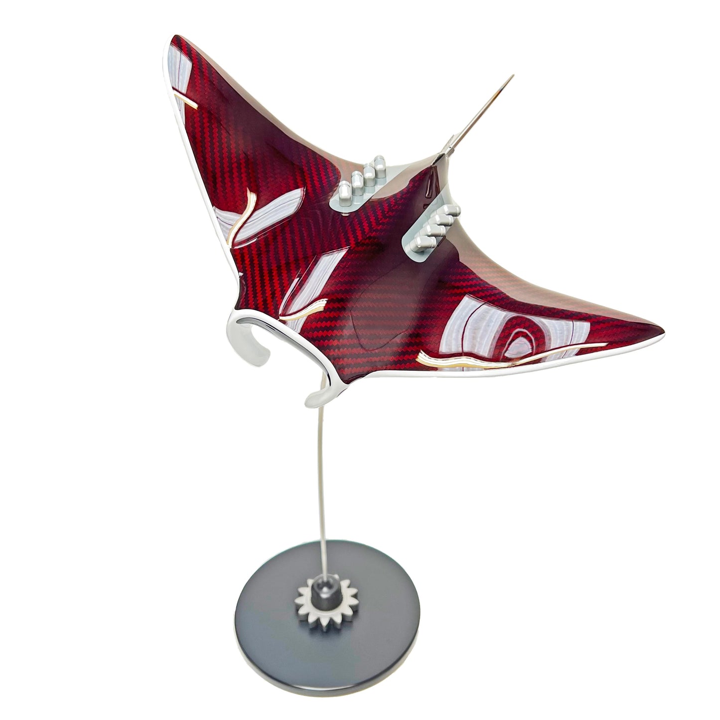 Carbon fibre red tinted Manta ray on a black base with F1 gear