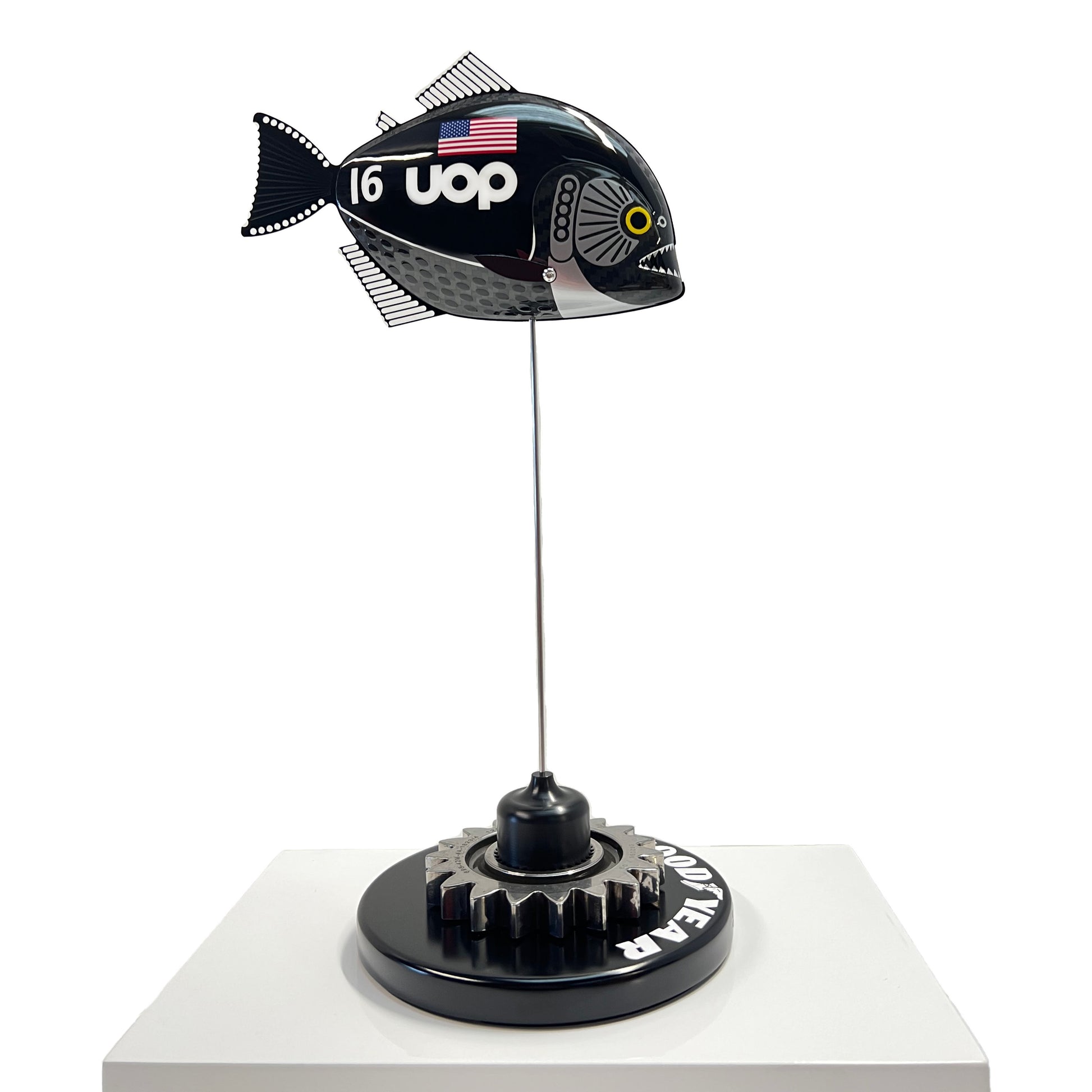 Carbon fibre Piranha fish with UOP livery on a black base with F1 gear